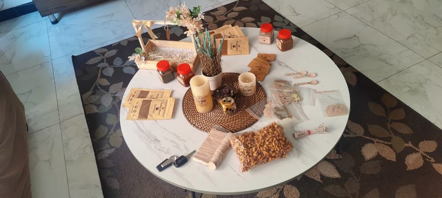 Packing table with chutney jars and masala pouches