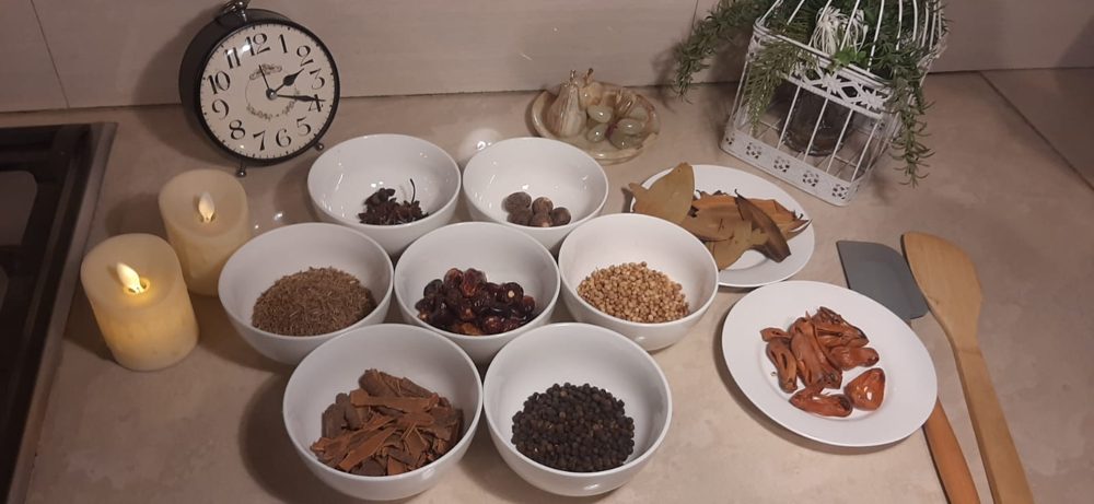 Whole spices and mace on the kitchen counter